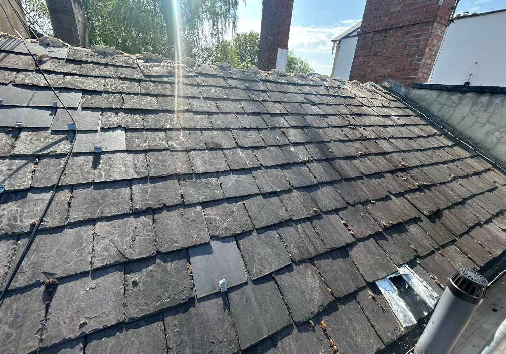 Roof Repairs and Replacement in Cheltenham Townhouse After Leak