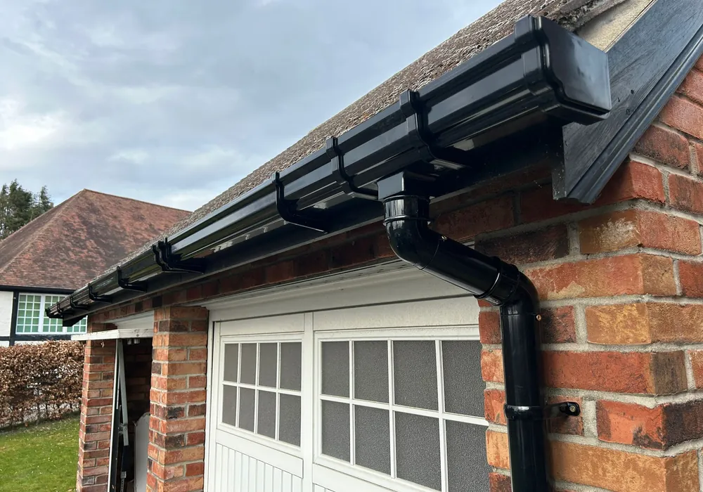 Black ogee gutter replacement on a Cheltenham property