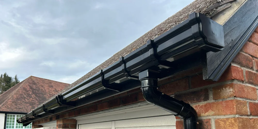 Why Water Runs Behind Your Gutters Instead of Into Them